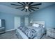 Relaxing bedroom featuring ceiling fan, bedside table, and dresser at 4991 Lake Palmetto Ln, North Charleston, SC 29418