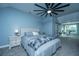 Comfortable bedroom with a study desk near the window, next to a bed with dresser at 4991 Lake Palmetto Ln, North Charleston, SC 29418
