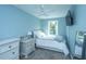 Comfortable bedroom with a cozy bed, and a window offering natural light at 4991 Lake Palmetto Ln, North Charleston, SC 29418