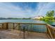 Beautiful lake view from the wood deck, complete with a small bistro table at 4991 Lake Palmetto Ln, North Charleston, SC 29418