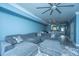 Spacious living area with modern gray sectional couch, plush ottoman and open concept to dining and kitchen at 4991 Lake Palmetto Ln, North Charleston, SC 29418