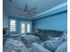 Comfortable living room features plush seating, ceiling fan, and stylish decor overlooking the outdoor deck at 4991 Lake Palmetto Ln, North Charleston, SC 29418