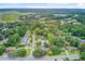 Aerial perspective of a neighborhood with lush greenery, roads, and waterways at 501 Joseph St, Charleston, SC 29412