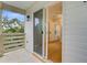 Balcony featuring trees, an open sliding glass door, and wood-look flooring at 501 Joseph St, Charleston, SC 29412