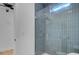 Bright bathroom with a glass-enclosed shower with vertical blue tiles at 501 Joseph St, Charleston, SC 29412