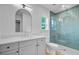 Bathroom featuring a glass enclosed shower with subway tiles, a window, and modern vanity at 501 Joseph St, Charleston, SC 29412