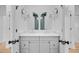 Elegant bathroom with dual vanities, modern fixtures, and arch mirrors at 501 Joseph St, Charleston, SC 29412