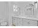 Bathroom features dual sinks, framed mirrors, vanity with storage, and modern fixtures at 501 Joseph St, Charleston, SC 29412