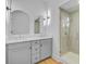 Elegant bathroom featuring double vanity, modern lighting, and a glass-enclosed shower at 501 Joseph St, Charleston, SC 29412