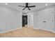 Bedroom with hardwood floors, ceiling fan, closet, and entrances to other rooms at 501 Joseph St, Charleston, SC 29412