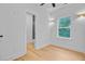 Bright bedroom with ensuite bathroom, ceiling fan, and natural light from window at 501 Joseph St, Charleston, SC 29412