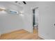 Bright bedroom with wood floors, ceiling fan, and an ensuite bathroom at 501 Joseph St, Charleston, SC 29412