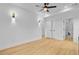 Bright bedroom featuring a ceiling fan, hardwood floors, and ensuite bathroom at 501 Joseph St, Charleston, SC 29412