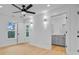 Bright bedroom with ensuite bathroom, ceiling fan, and windows with natural light at 501 Joseph St, Charleston, SC 29412