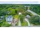 Exterior aerial view displays the home with a long driveway, a generous yard, and the surrounding residential community at 501 Joseph St, Charleston, SC 29412