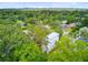 Angle shot reveals the home's exterior with lots of green trees and landscaping at 501 Joseph St, Charleston, SC 29412