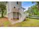 Elevated construction with white siding and wooden stairs, featuring a lush, grassy lawn at 501 Joseph St, Charleston, SC 29412