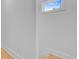 Bright hallway with white walls, wood floors, and natural light from window at 501 Joseph St, Charleston, SC 29412