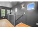 Upstairs hallway with hardwood floors, natural light and dark grey walls at 501 Joseph St, Charleston, SC 29412