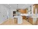 Modern island kitchen featuring stainless steel appliances, white backsplash, a sink and wooden cabinets at 501 Joseph St, Charleston, SC 29412
