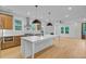 Bright kitchen featuring stainless steel appliances, wood cabinets, and a center island with a sink at 501 Joseph St, Charleston, SC 29412