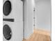 Modern laundry area with a stacked washer and dryer and wood floor at 501 Joseph St, Charleston, SC 29412