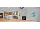 Bright open-concept room featuring an island kitchen, stainless appliances and a modern fireplace at 501 Joseph St, Charleston, SC 29412