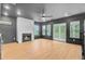 Living room featuring fireplace, hardwood floors, natural light, and sliding doors at 501 Joseph St, Charleston, SC 29412