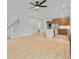 Spacious open-concept living area with a staircase, an island kitchen, light colored floors and recessed lighting at 501 Joseph St, Charleston, SC 29412