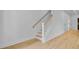 Clean, bright staircase with light wood railing and white risers, offering a modern look at 501 Joseph St, Charleston, SC 29412