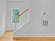 Bright stairway featuring white railings and a window providing natural light at 501 Joseph St, Charleston, SC 29412
