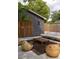Private backyard setup with a detached garage, and outdoor seating for relaxing at 5065 Durant Ave, North Charleston, SC 29405