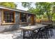 Cozy backyard featuring a patio with an outdoor dining table, perfect for enjoying the outdoors at 5065 Durant Ave, North Charleston, SC 29405