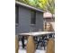 Backyard patio features a modern brick house, dining table, and brick pavers at 5065 Durant Ave, North Charleston, SC 29405