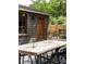 Backyard features a large dining table with chairs and a view of the guest house at 5065 Durant Ave, North Charleston, SC 29405