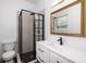 Modern bathroom featuring a new shower with glass enclosure and updated fixtures at 5065 Durant Ave, North Charleston, SC 29405