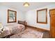 Bedroom with hardwood floors, natural light, vintage furniture, and neutral walls at 5065 Durant Ave, North Charleston, SC 29405