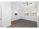 Modern bedroom with gray wood floors, three windows, neutral walls and contemporary lighting at 5065 Durant Ave, North Charleston, SC 29405