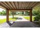 View of the covered parking area showcasing the wooden support beams and view of the community at 5065 Durant Ave, North Charleston, SC 29405