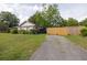 Long driveway leading to the home and backyard, surrounded by lush green grass at 5065 Durant Ave, North Charleston, SC 29405