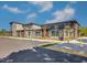 Modern building with a mix of brick and siding, enhanced by mature landscaping, sits under a sunny sky with ample parking at 5065 Durant Ave, North Charleston, SC 29405