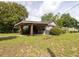 Charming home exterior with a well-manicured lawn and inviting covered porch at 5065 Durant Ave, North Charleston, SC 29405