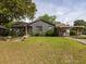 Beautiful home exterior with mature landscaping and a welcoming front porch at 5065 Durant Ave, North Charleston, SC 29405