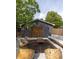 Aesthetic backyard features a detached garage, stylish seating and an outdoor living space at 5065 Durant Ave, North Charleston, SC 29405