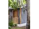 Charming guest house with wood siding, inviting entrance, and shaded by a tree at 5065 Durant Ave, North Charleston, SC 29405