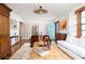 Well-lit living room with hardwood floors, vintage furniture, and neutral color palette at 5065 Durant Ave, North Charleston, SC 29405
