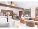 Cozy living room features beamed ceilings, hardwood floors, comfortable seating, and natural light at 5065 Durant Ave, North Charleston, SC 29405