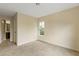 Neutral bedroom with carpet flooring and a window for natural light at 5104 E Liberty Park Cir, North Charleston, SC 29405