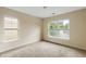 Cozy bedroom featuring two windows with bright natural light and neutral carpet and trim at 5104 E Liberty Park Cir, North Charleston, SC 29405