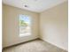 Bright bedroom with neutral walls, plush carpet, and a large window offering plenty of natural light at 5104 E Liberty Park Cir, North Charleston, SC 29405